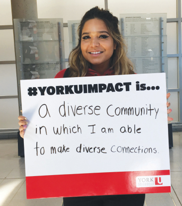 YorkU student holding sign about diversity